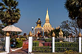 Vientiane, Laos - Surrounded by a cluster of pointed minor stupas the huge Pha That Luang shined under the warm light of the sunset.  